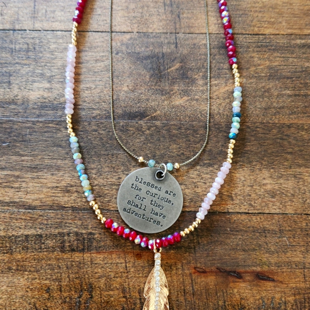 Wanderlust Pendant Necklace with Multicolor Beads and Feather Pendant.